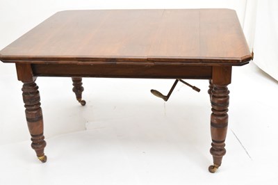 Lot 799 - Edwardian walnut 'Selbat' trademark extending dining table