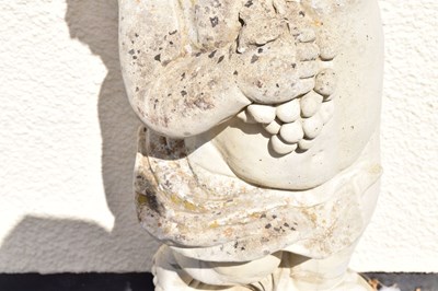 Lot 795 - Composite stone garden statue of a cherub holding grapes