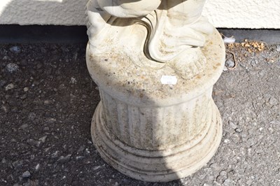 Lot 795 - Composite stone garden statue of a cherub holding grapes