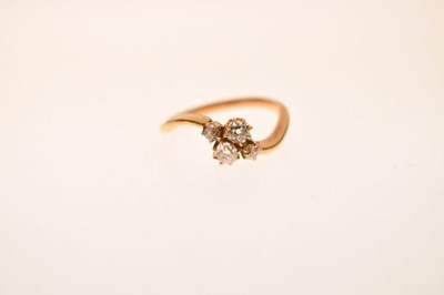Lot 7 - Four-stone diamond 18ct gold crossover ring