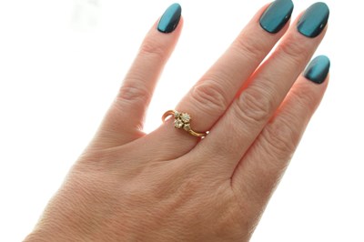 Lot 7 - Four-stone diamond 18ct gold crossover ring