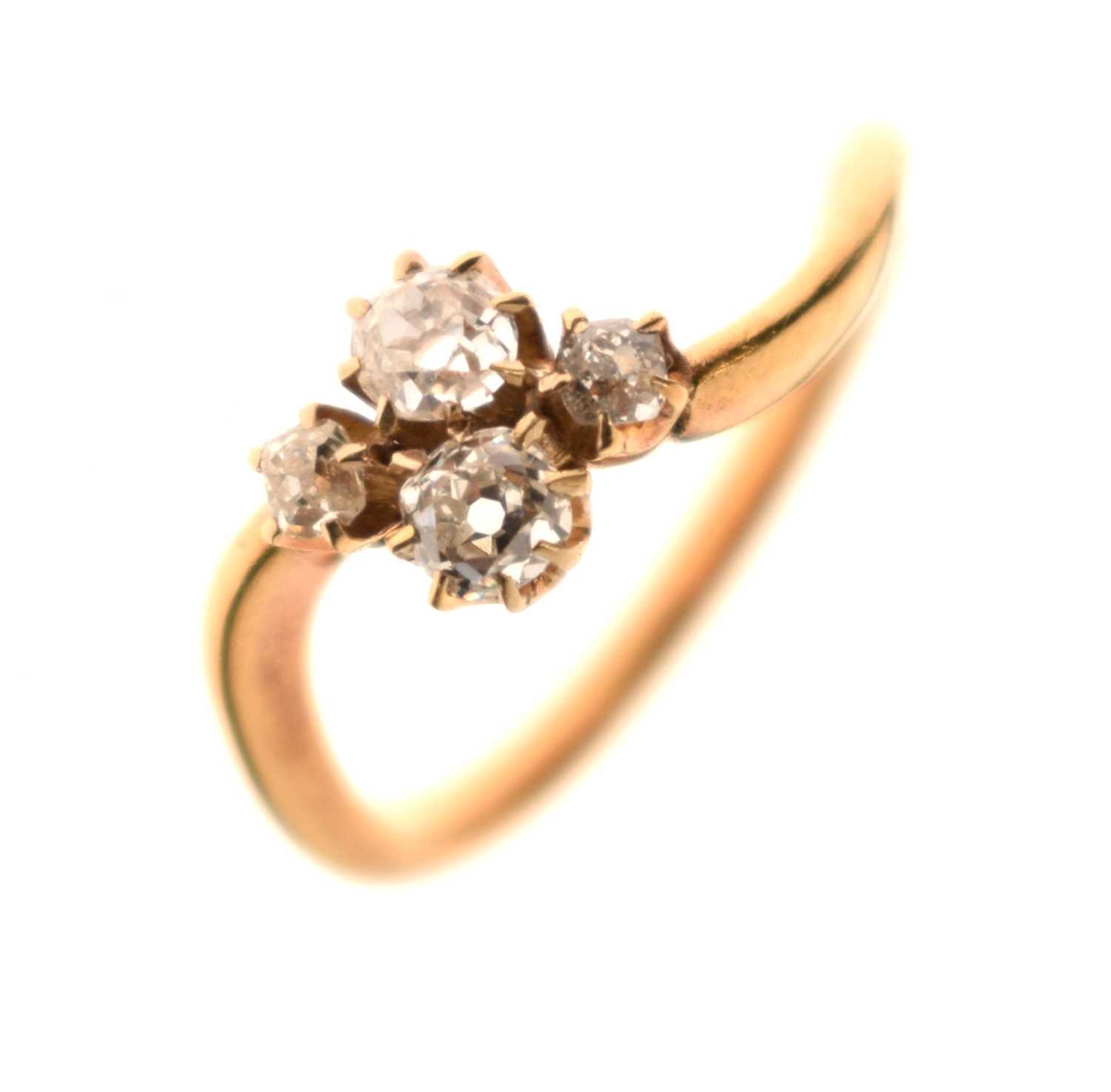 Lot 7 - Four-stone diamond 18ct gold crossover ring