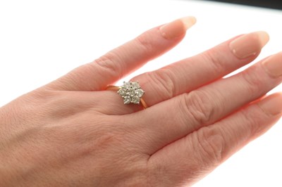 Lot 13 - Diamond flower head 18ct yellow and white gold set cluster ring