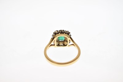 Lot 19 - Unmarked yellow metal, emerald and diamond cluster ring