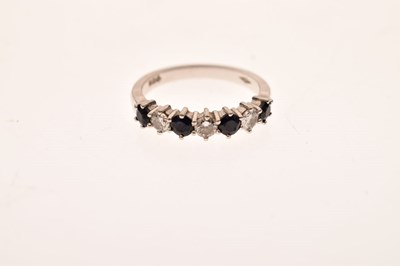 Lot 16 - Diamond and sapphire platinum seven stone half eternity ring