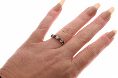 Lot 16 - Diamond and sapphire platinum seven stone half eternity ring