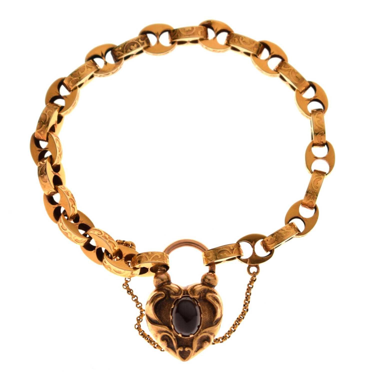 Lot 48 - Victorian unmarked gold engraved mariner link bracelet with garnet carbuncle heart locket
