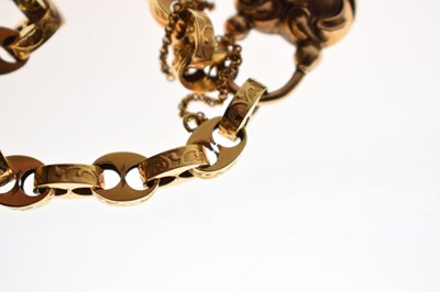 Lot 48 - Victorian unmarked gold engraved mariner link bracelet with garnet carbuncle heart locket