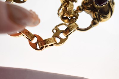 Lot 48 - Victorian unmarked gold engraved mariner link bracelet with garnet carbuncle heart locket
