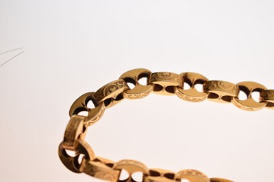 Lot 48 - Victorian unmarked gold engraved mariner link bracelet with garnet carbuncle heart locket