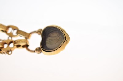 Lot 48 - Victorian unmarked gold engraved mariner link bracelet with garnet carbuncle heart locket