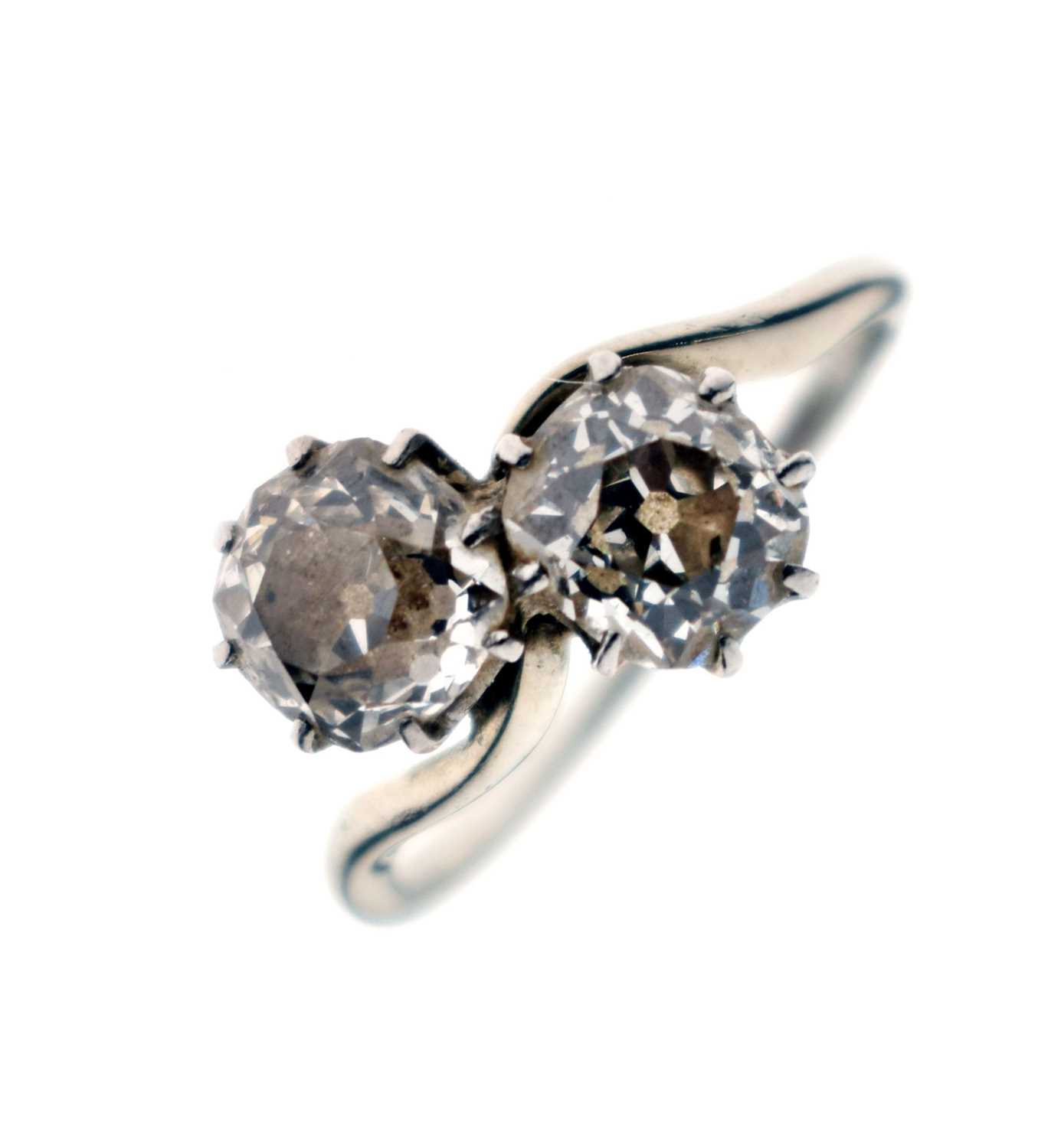Lot 4 - Diamond 18ct white gold and platinum set two stone diamond ring of crossover design
