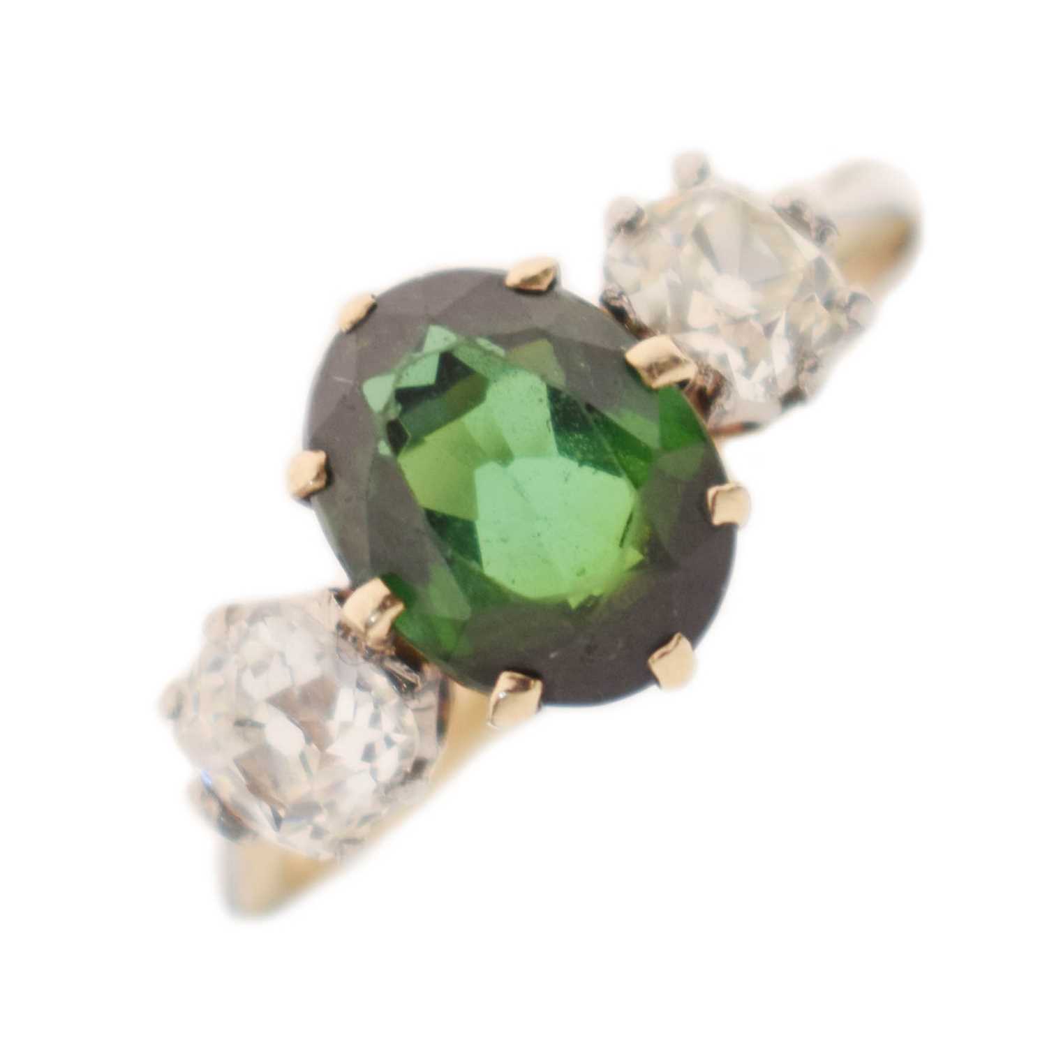 Lot 26 - Green tourmaline and diamond 18ct gold and platinum set three-stone ring