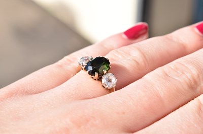 Lot 26 - Green tourmaline and diamond 18ct gold and platinum set three-stone ring
