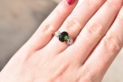 Lot 26 - Green tourmaline and diamond 18ct gold and platinum set three-stone ring