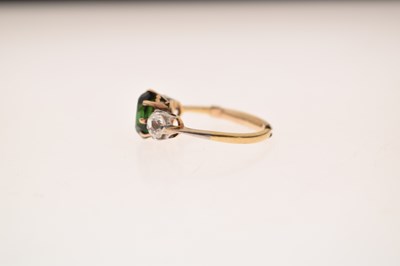 Lot 26 - Green tourmaline and diamond 18ct gold and platinum set three-stone ring