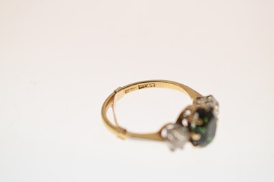 Lot 26 - Green tourmaline and diamond 18ct gold and platinum set three-stone ring