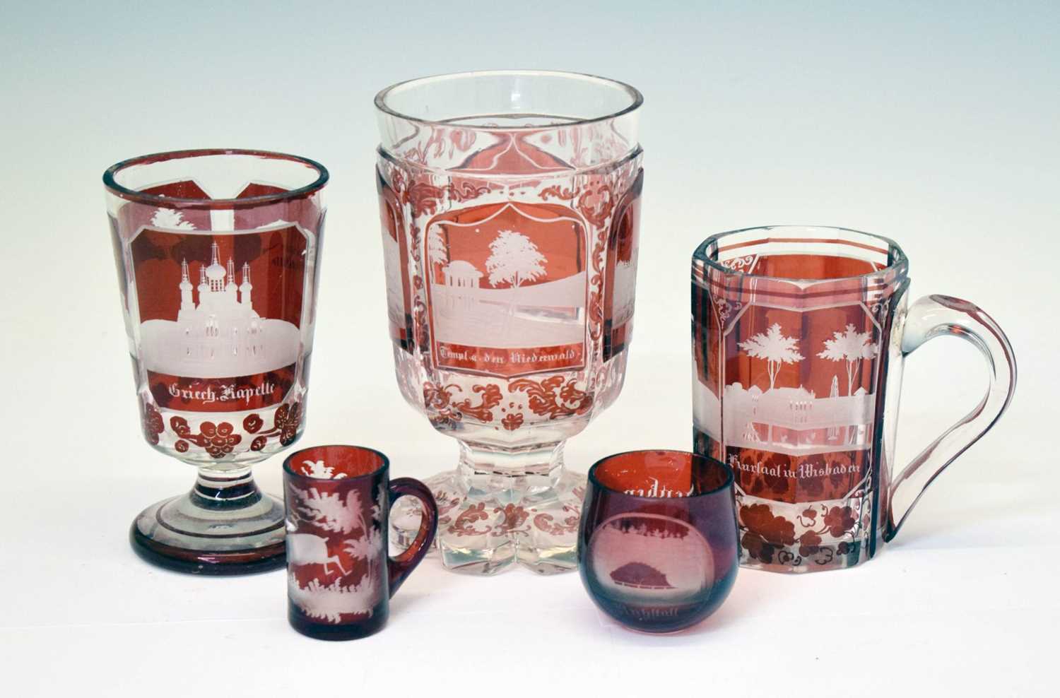 Lot 214 - Group of 19th century Bohemian ruby flashed and topographically engraved glass