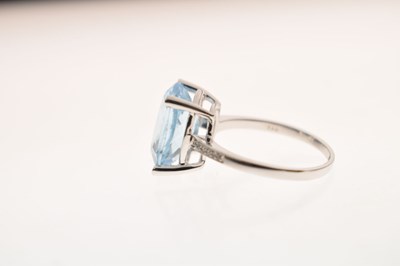 Lot 16 - Blue topaz and diamond white metal ring