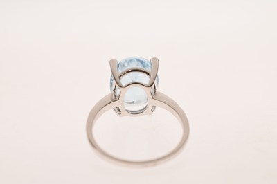 Lot 16 - Blue topaz and diamond white metal ring