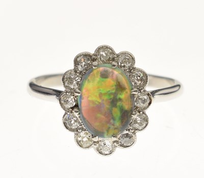 Lot 15 - Black opal and diamond platinum cluster ring