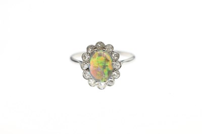 Lot 15 - Black opal and diamond platinum cluster ring