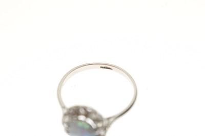 Lot 15 - Black opal and diamond platinum cluster ring