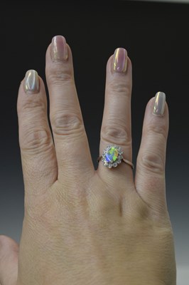 Lot 15 - Black opal and diamond platinum cluster ring