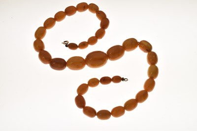 Lot 37 - String of graduated oval butterscotch amber beads