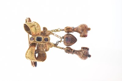 Lot 34 - Early to mid 19th century garnet unmarked yellow metal ribbon brooch