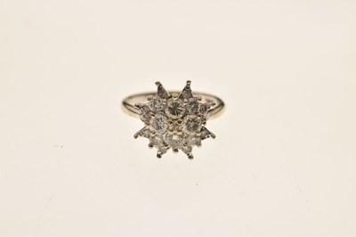 Lot 8 - Diamond white metal cluster ring stamped 18ct