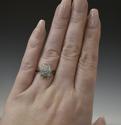 Lot 8 - Diamond white metal cluster ring stamped 18ct