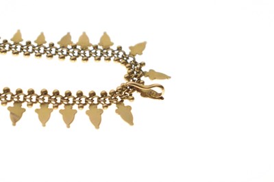 Lot 40 - Victorian unmarked yellow metal acorn fringed necklace