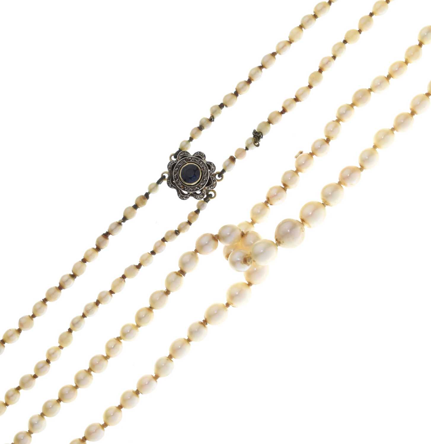 Lot 43 - Edwardian graduated pearl double string necklace with sapphire set clasp