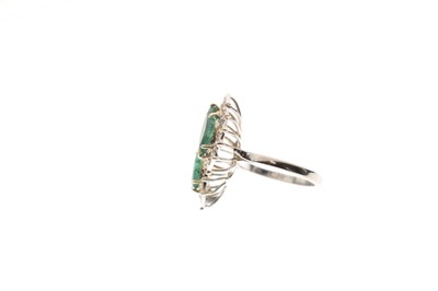 Lot 4 - Emerald and diamond double marquise white metal cluster ring
