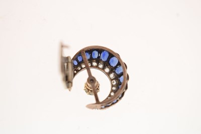 Lot 23 - Early 20th century diamond and sapphire crescent form scarf clip