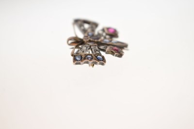 Lot Diamond, ruby and sapphire yellow and white metal set pendant brooch in the form of a butterfly