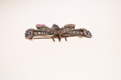Lot Diamond, ruby and sapphire yellow and white metal set pendant brooch in the form of a butterfly
