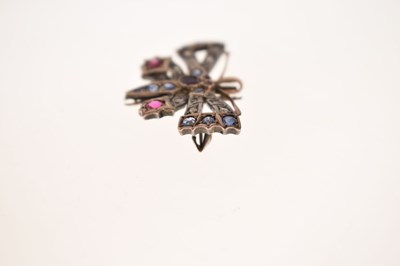 Lot Diamond, ruby and sapphire yellow and white metal set pendant brooch in the form of a butterfly