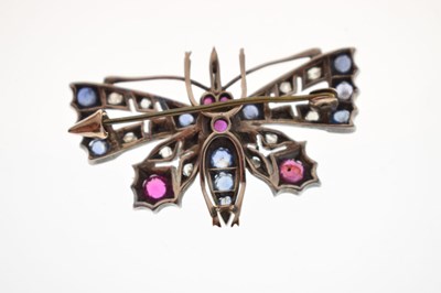 Lot Diamond, ruby and sapphire yellow and white metal set pendant brooch in the form of a butterfly