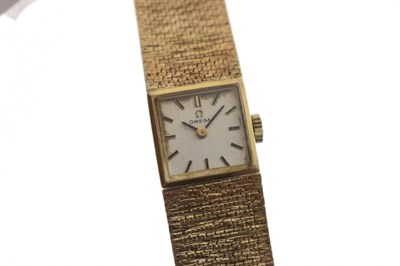 Lot Omega - Lady's 1960s 9ct gold bracelet watch