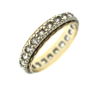 Lot 6 - Full eternity ring set white stones, stamped '9ct'