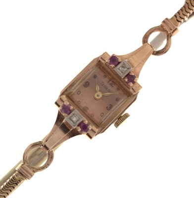 Lot 236 - Tenens - Lady's diamond and ruby-set yellow metal cased bracelet watch