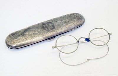 Lot 253 - Late Victorian silver-mounted glasses case with engraved decoration