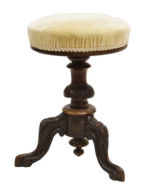 Lot 767 - Mid Victorian carved walnut adjustable piano stool