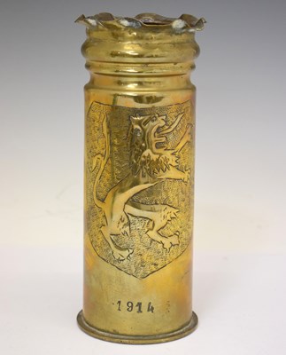 Lot 461 - Great War brass trench art shell casing / vase with embossed shield decoration