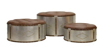 Lot 680 - Stacking nest of three metal bound tan leather stools
