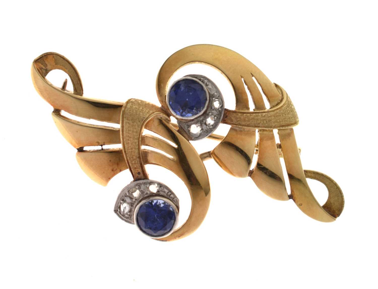 Lot Sapphire and diamond scroll brooch