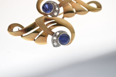 Lot Sapphire and diamond scroll brooch