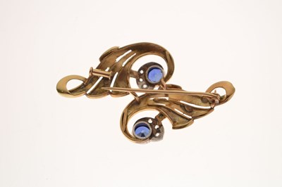 Lot Sapphire and diamond scroll brooch